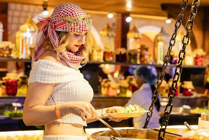 Red Desert Safari With Camel Ride & Sand Skiing - Bedouin camp evening: shows, costumes, and the BBQ setup